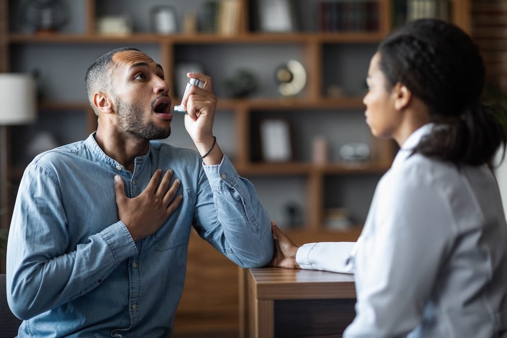 Asthma specialist treating a patient.